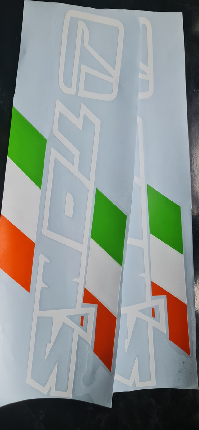 White Toyota side decals with green and orange stripes